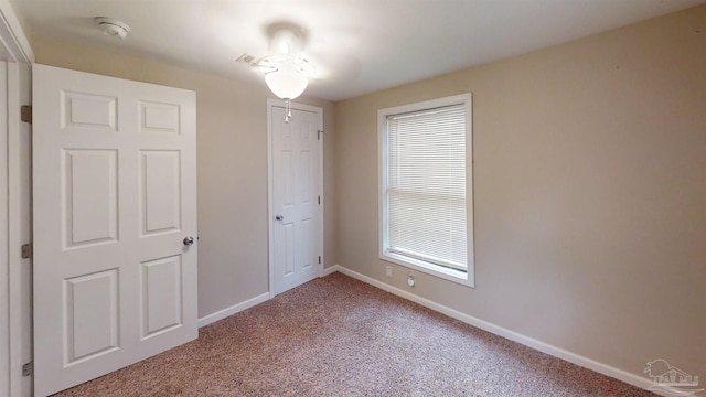 unfurnished bedroom with carpet floors