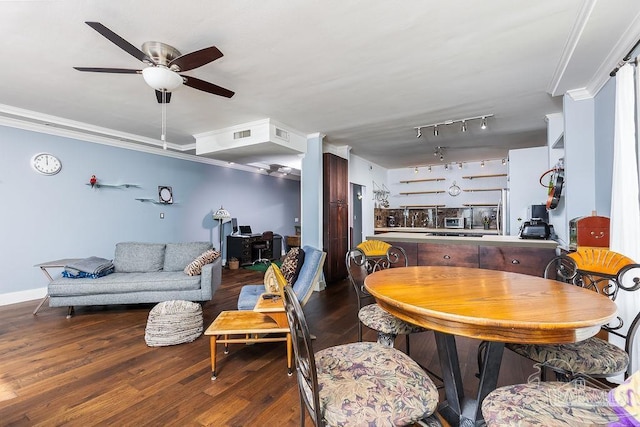 dining space with hardwood / wood-style floors, ceiling fan, and ornamental molding