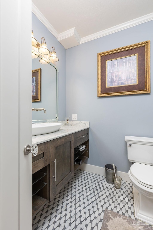 bathroom featuring tile patterned floors, vanity, toilet, and ornamental molding