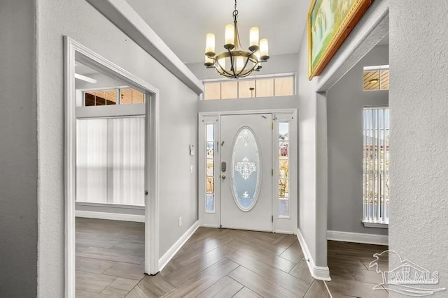 7210 Annandale Dr, Pensacola, FL 32526 - entryway featuring a chandelier and hardwood / wood-style floors