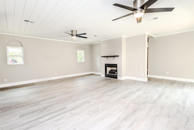 unfurnished living room featuring light wood-style flooring, a ceiling fan, visible vents, and ornamental molding