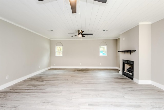 unfurnished living room with light wood-type flooring, a fireplace, ornamental molding, and a ceiling fan