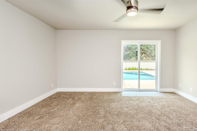 unfurnished room featuring ceiling fan, baseboards, and carpet