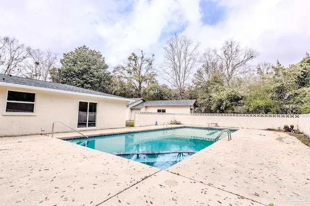 view of swimming pool with a fenced in pool, a patio area, and fence