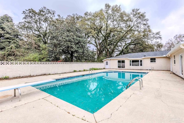 view of pool featuring a patio, a fenced backyard, and a fenced in pool