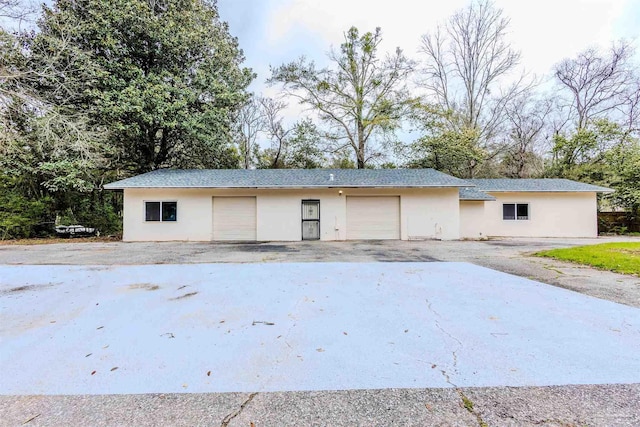 garage featuring aphalt driveway