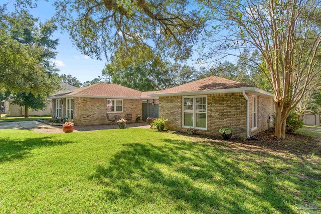 ranch-style home with a patio area and a front yard