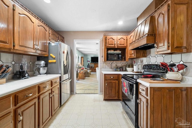 kitchen with black electric range, custom range hood, decorative backsplash, and stainless steel refrigerator with ice dispenser