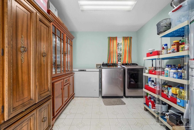 washroom with washer and dryer