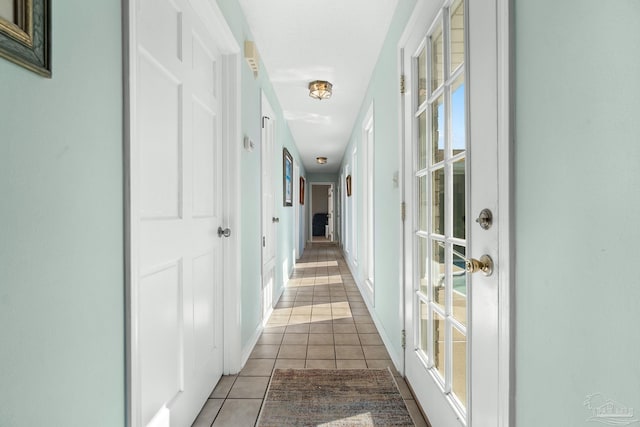 hallway with light tile patterned floors