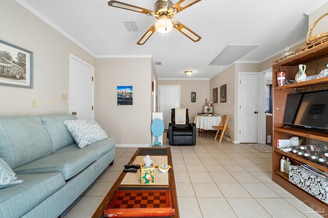 tiled living room with ornamental molding and ceiling fan