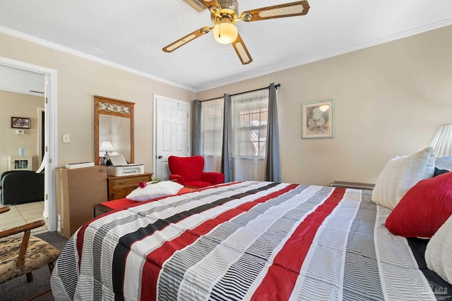 tiled bedroom with ornamental molding, a textured ceiling, and ceiling fan