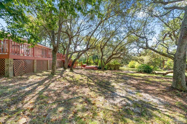 view of yard featuring a deck