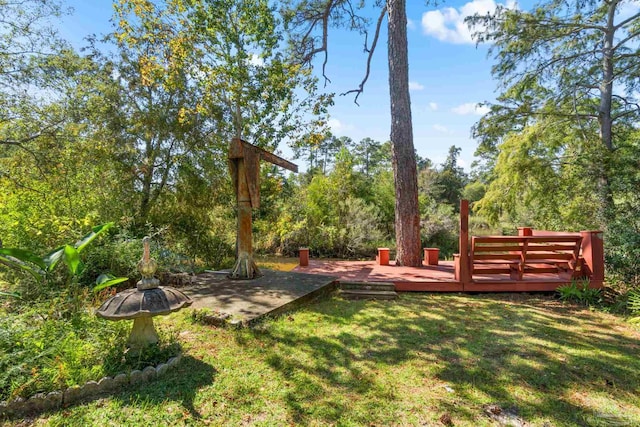 view of yard featuring a wooden deck