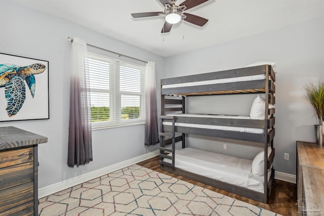 bedroom featuring dark wood-type flooring and ceiling fan