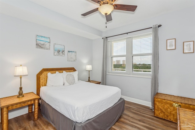 bedroom featuring dark hardwood / wood-style flooring and ceiling fan