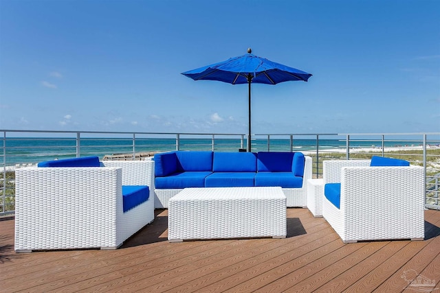 wooden deck featuring a water view and outdoor lounge area