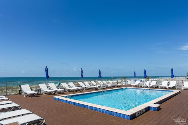 view of swimming pool featuring a water view