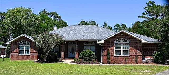 single story home featuring a front lawn