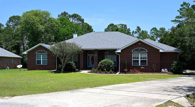 single story home with a front yard