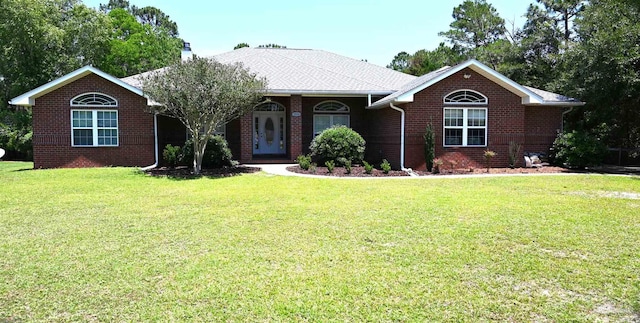 single story home featuring a front lawn