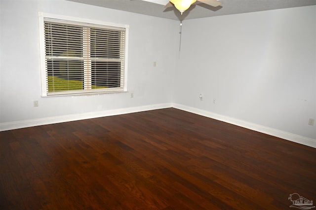 spare room featuring hardwood / wood-style floors and ceiling fan