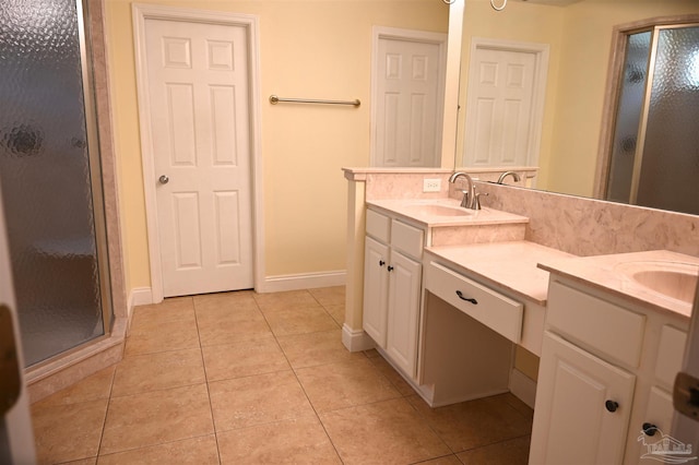 bathroom featuring vanity, tile patterned floors, and tasteful backsplash