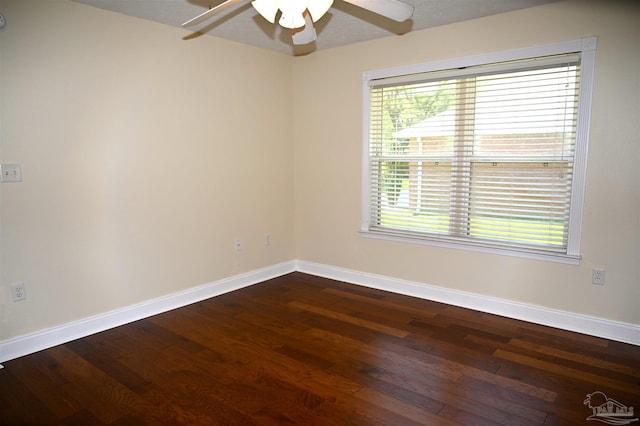 spare room featuring ceiling fan and dark hardwood / wood-style floors