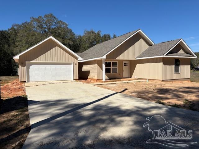 view of front of house with a garage and driveway