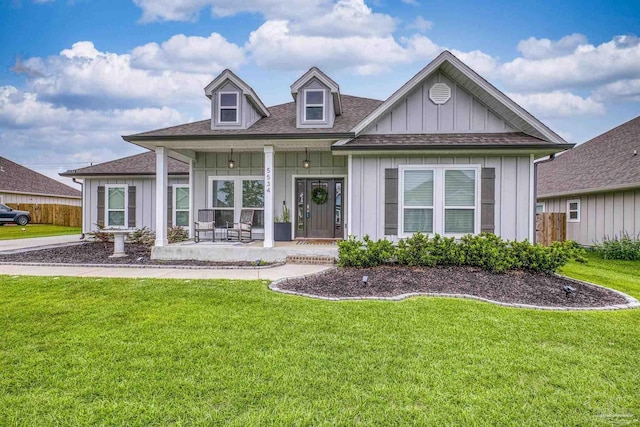 5534 Blake Ln, Pace, FL 32571 - view of front of home with board and batten siding, covered porch, and a shingled roof