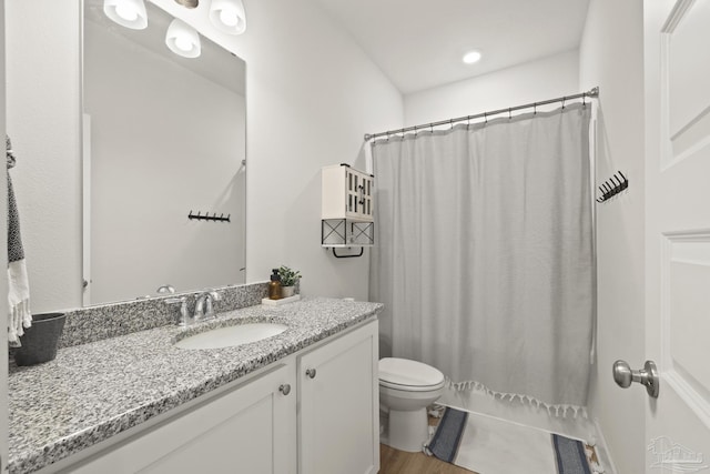5534 Blake Ln, Pace, FL 32571 - full bath featuring toilet, vanity, wood finished floors, and a shower with curtain