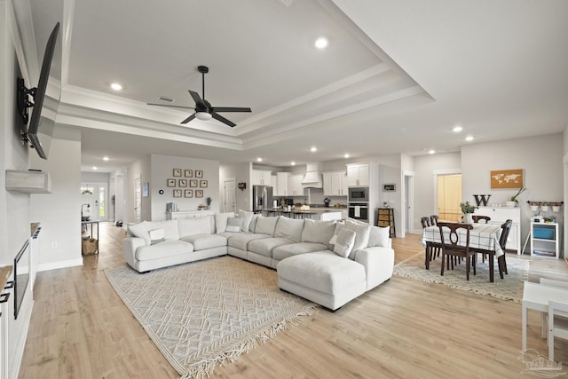 5534 Blake Ln, Pace, FL 32571 - living room with recessed lighting, a ceiling fan, light wood-type flooring, a raised ceiling, and ornamental molding
