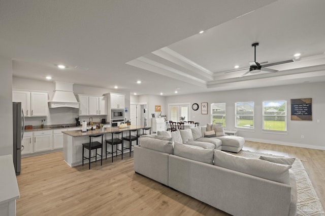 5534 Blake Ln, Pace, FL 32571 - living room featuring recessed lighting, a ceiling fan, light wood finished floors, and a raised ceiling