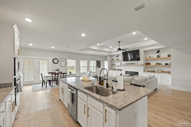5534 Blake Ln, Pace, FL 32571 - kitchen featuring a sink, appliances with stainless steel finishes, a fireplace, a center island with sink, and recessed lighting