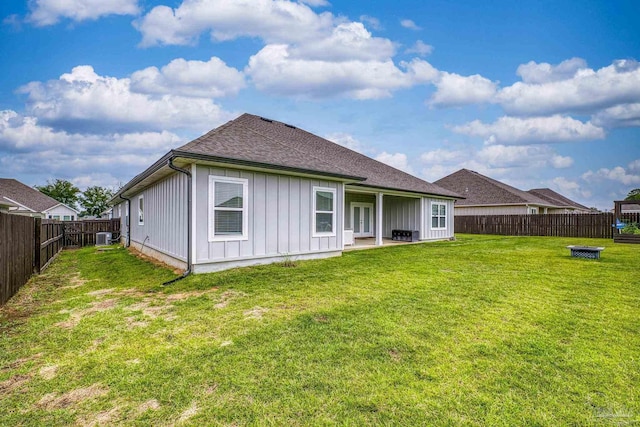 5534 Blake Ln, Pace, FL 32571 - back of property featuring board and batten siding, a shingled roof, and central AC