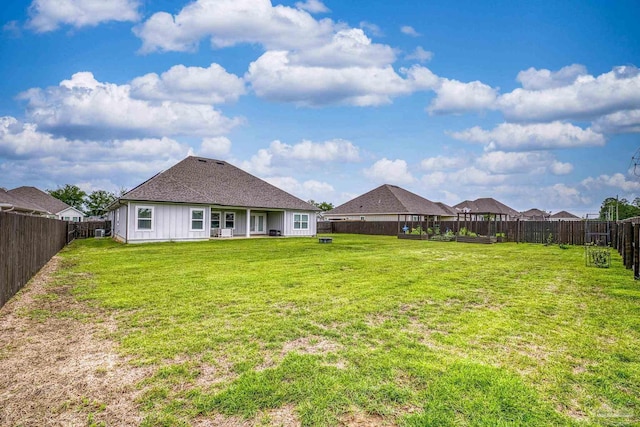 5534 Blake Ln, Pace, FL 32571 - rear view of house with a shingled roof