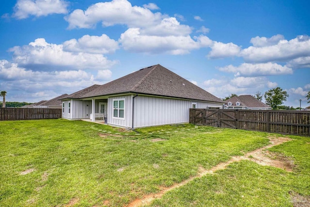 5534 Blake Ln, Pace, FL 32571 - back of house with a shingled roof, a gate, and board and batten siding