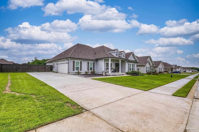5534 Blake Ln, Pace, FL 32571 - view of front facade with concrete driveway, an attached garage, covered porch, a shingled roof, and board and batten siding