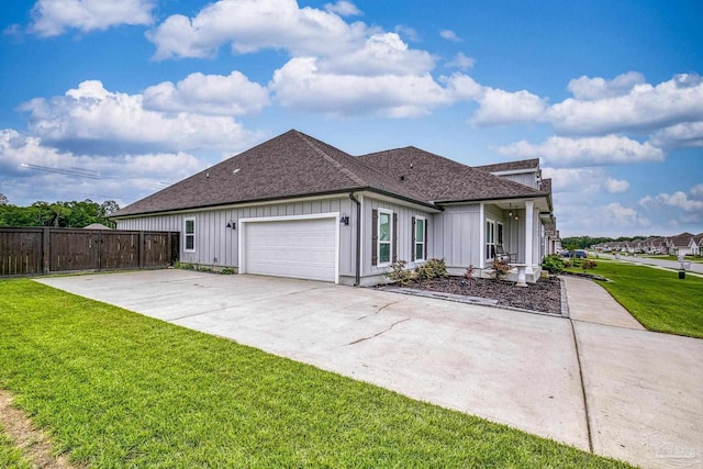 5534 Blake Ln, Pace, FL 32571 - view of front of property with a shingled roof, board and batten siding, an attached garage, and concrete driveway