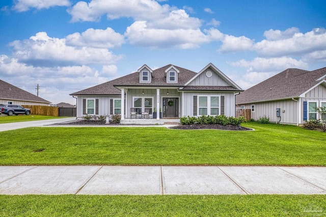 5534 Blake Ln, Pace, FL 32571 - view of front of home featuring covered porch, board and batten siding, and a shingled roof