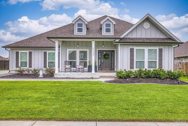 5534 Blake Ln, Pace, FL 32571 - view of front of house featuring board and batten siding, covered porch, and roof with shingles
