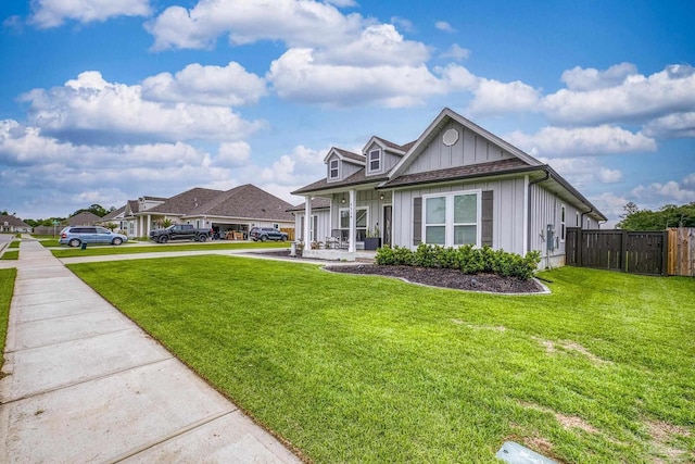 5534 Blake Ln, Pace, FL 32571 - view of front facade featuring board and batten siding and covered porch