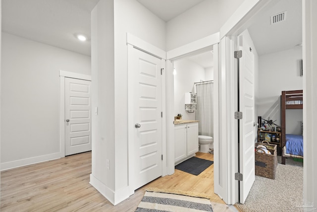 5534 Blake Ln, Pace, FL 32571 - hallway featuring light wood finished floors and baseboards