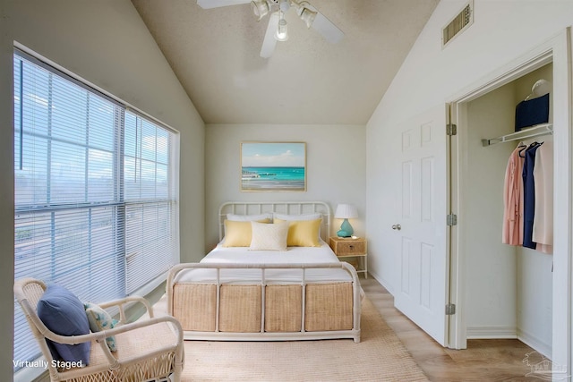 7101 Joy St Unit D5, Pensacola, FL 32504 - bedroom featuring lofted ceiling, baseboards, light wood-style floors, ceiling fan, and a closet
