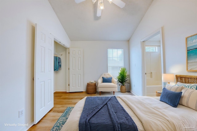 7101 Joy St Unit D5, Pensacola, FL 32504 - bedroom with vaulted ceiling, light wood finished floors, baseboards, ensuite bath, and ceiling fan