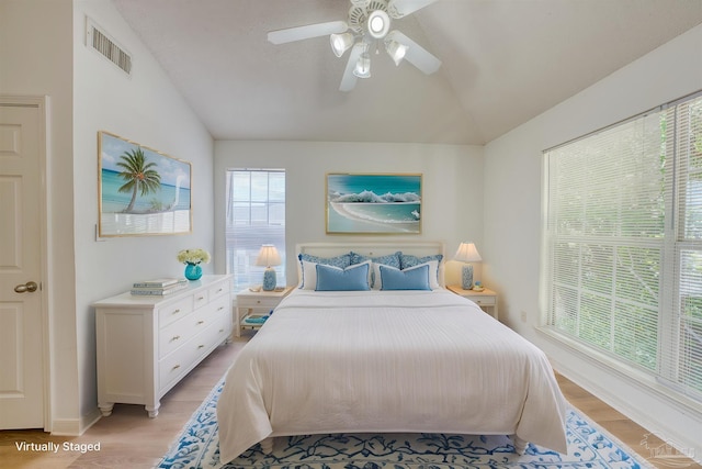 7101 Joy St Unit D5, Pensacola, FL 32504 - bedroom with vaulted ceiling, light wood finished floors, ceiling fan, and baseboards