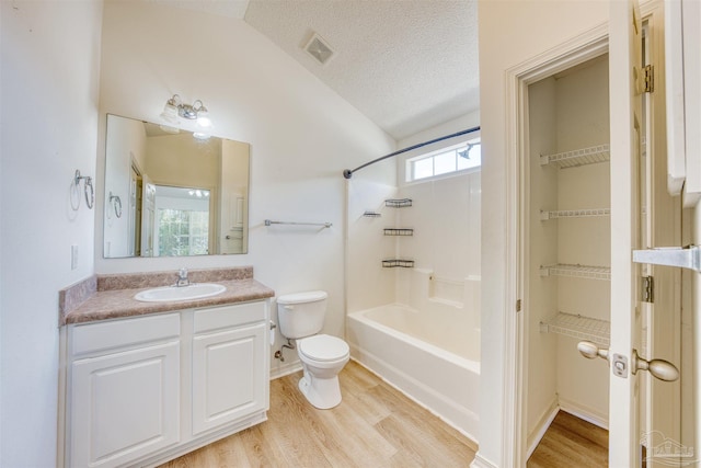 7101 Joy St Unit D5, Pensacola, FL 32504 - full bathroom with vaulted ceiling, wood finished floors, toilet, vanity, and bathtub / shower combination