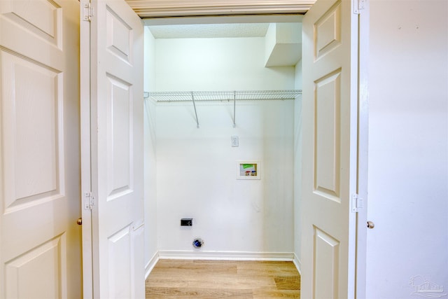 7101 Joy St Unit D5, Pensacola, FL 32504 - clothes washing area featuring washer hookup, light wood finished floors, hookup for an electric dryer, and baseboards