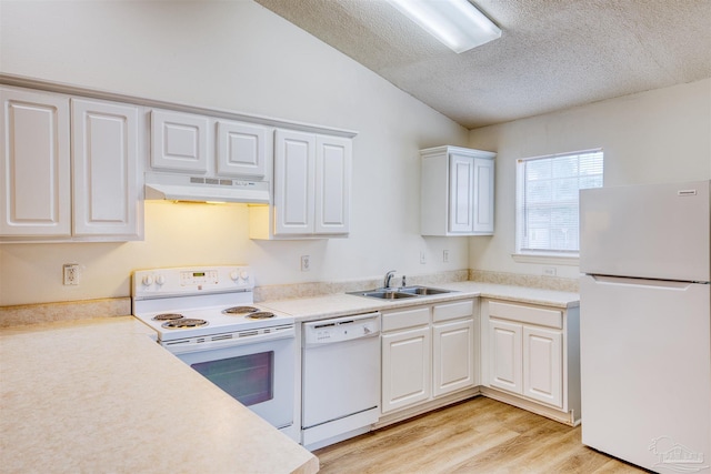7101 Joy St Unit D5, Pensacola, FL 32504 - kitchen with white appliances, under cabinet range hood, a sink, light wood-style flooring, and a textured ceiling