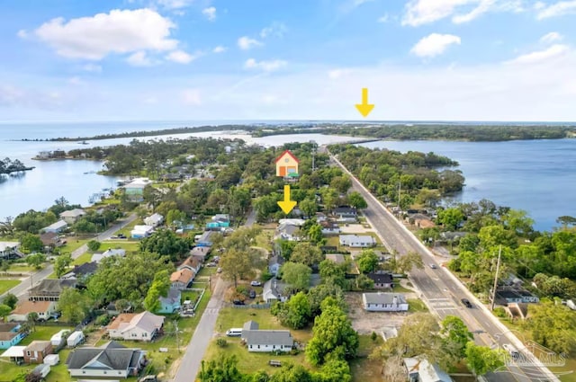 bird's eye view featuring a water view and a residential view